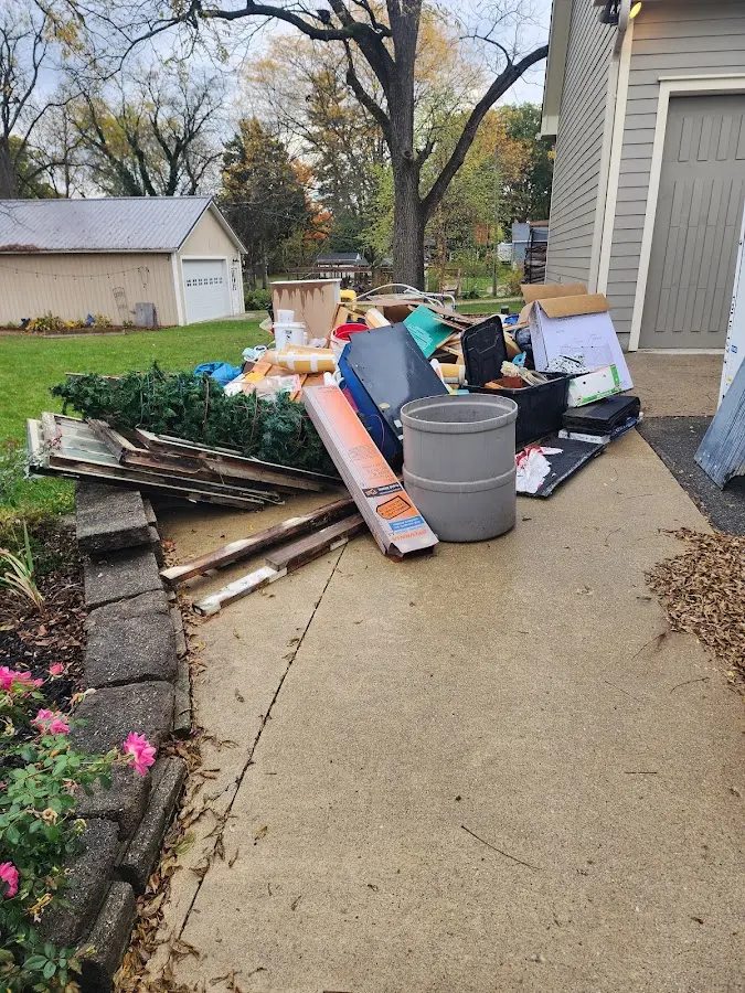 Dumpster being loaded with debris for Commercial Dumpster Rental in Mountain Home